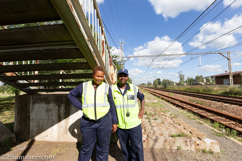 Security people next to the train tracks