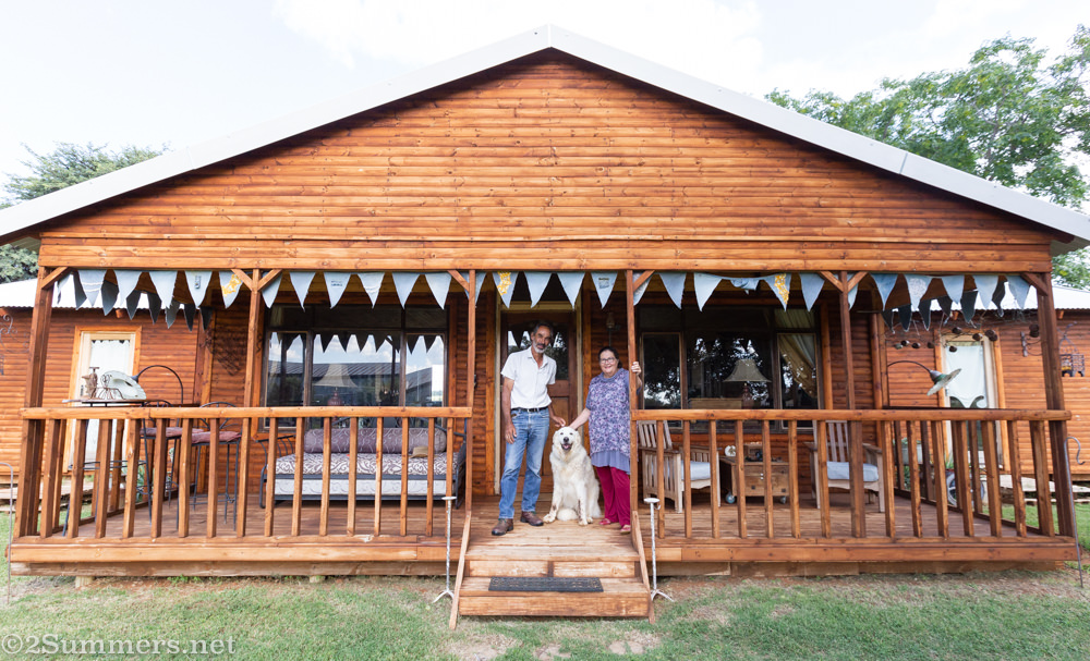 Hennie, Sandra, and their dog Leonardo at their new house