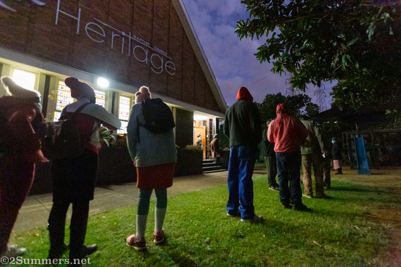 People waiting in line for food parcels