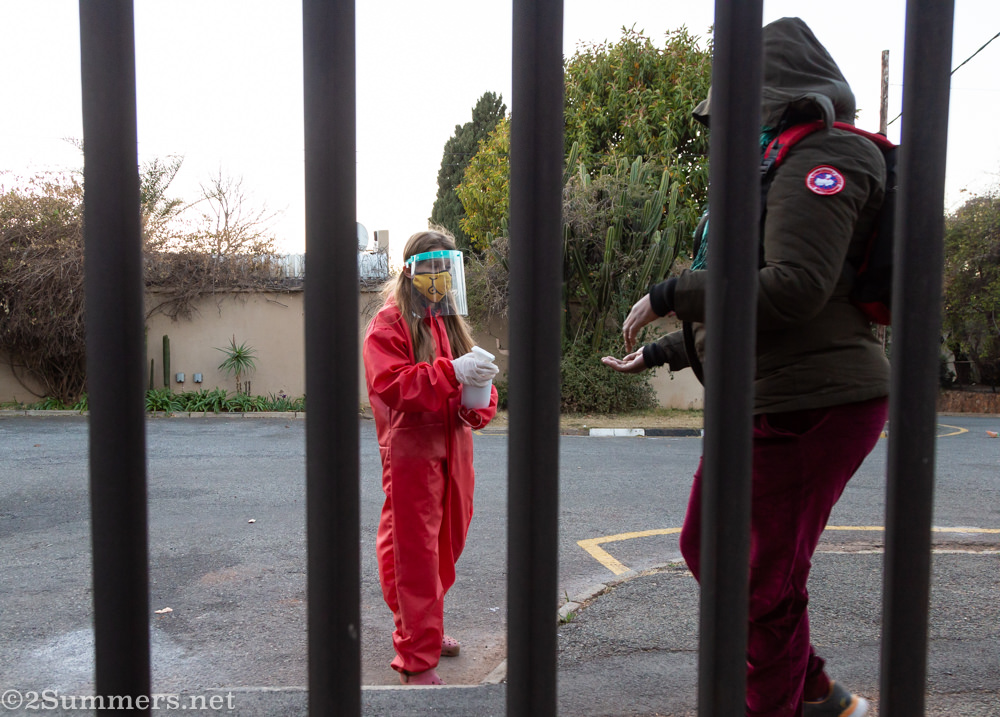 Hannah giving out hand sanitizer at the Melville Food Prgram
