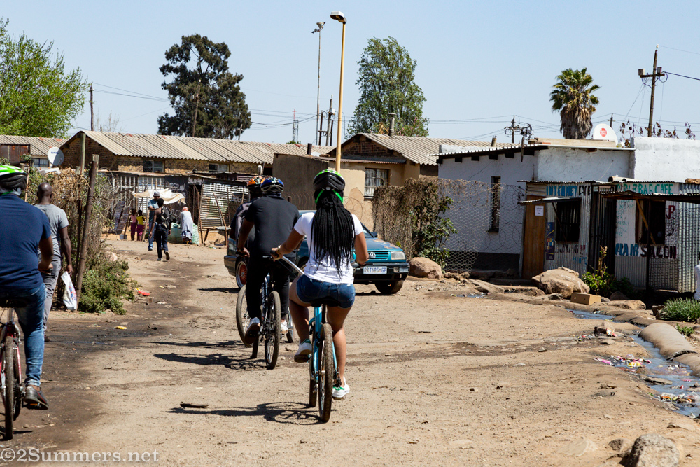 Riding through Mzimhlophe men's hostel