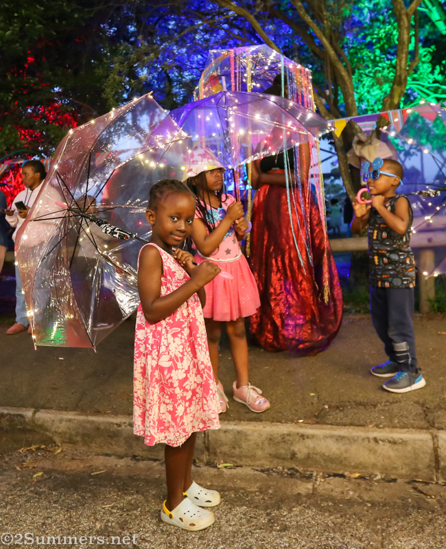 Little girl with lit-up umbrella