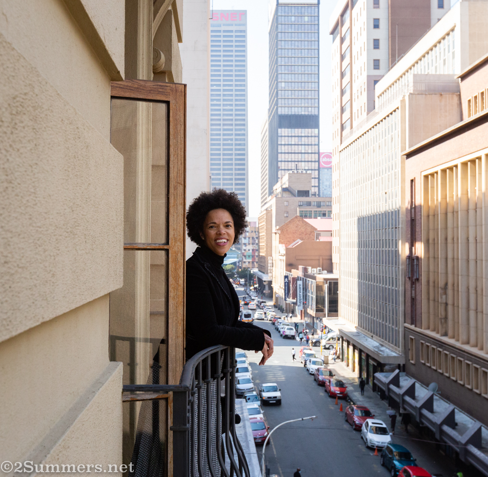 Alicia leaning out a window at the Rand Club