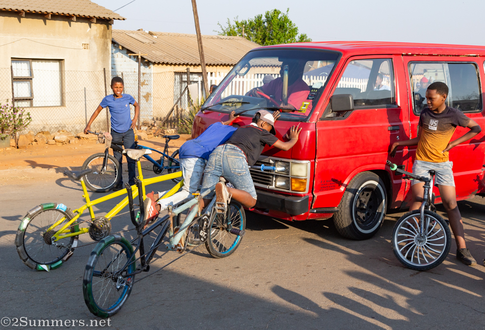 Spinners pushing a taxi backward