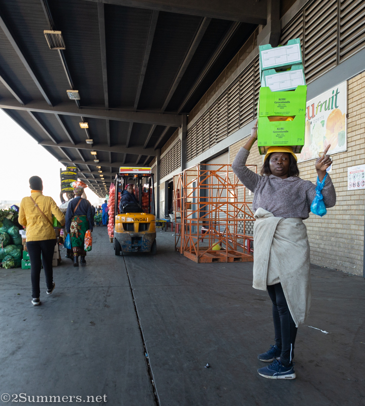 Lady with fruit boxes