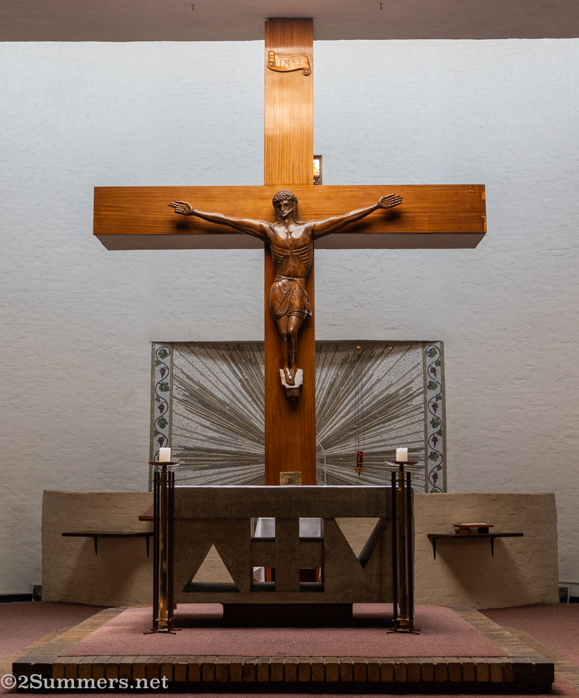 
Somehow I didn't take any wide shots looking straight on into the pulpit. But here is a frame showing the beautiful crucifix carving and mosaic behind the pulpit.