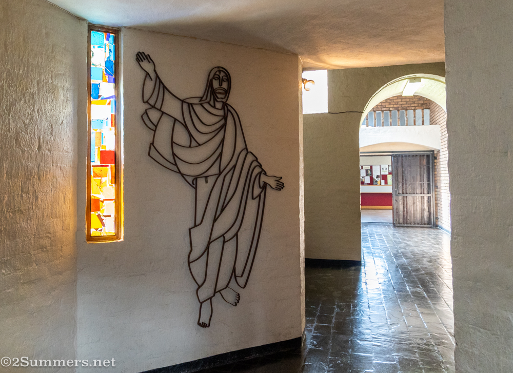 
Inside the church is an entrance hall that leads to a hallway (shown here), which in turn leads to the nave of the church.